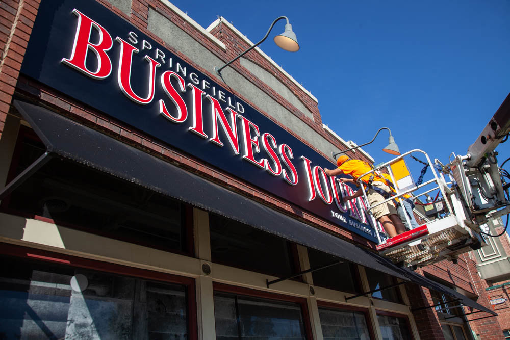 Missouri Neon Co. installs new signage for SBJ in Chesterfield Village.